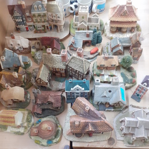 240 - A collection of ornamental buildings to include Lilliput Lane and a 1985 Naturecraft Dr Grey GP hous... 