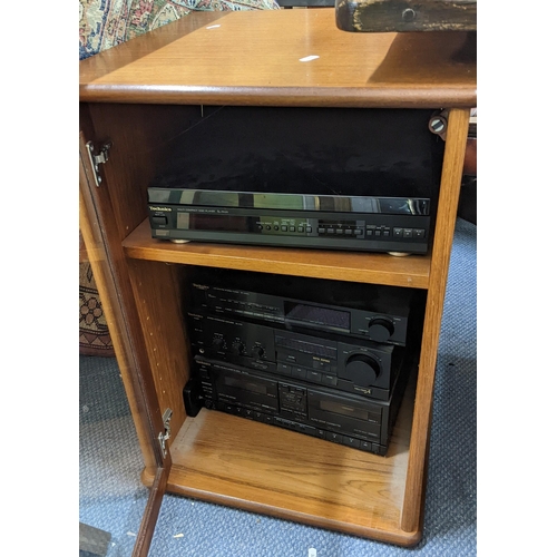 510 - A vintage G-Plan teak hi-fi cabinet containing a Technics stacking system and speakers
Location: A3M... 