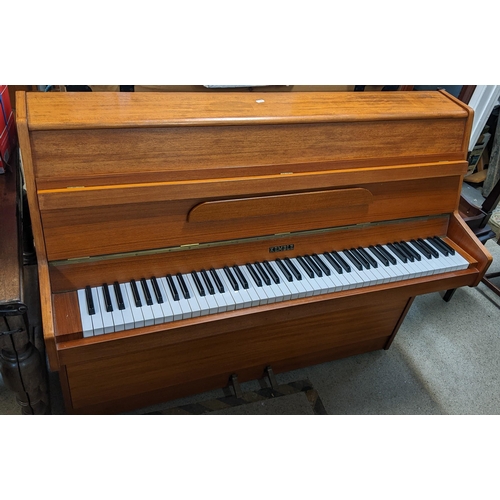 530 - A Kemble teak framed upright piano, 107cm h x 130cm w
Location:FOYER
If there is no condition report... 