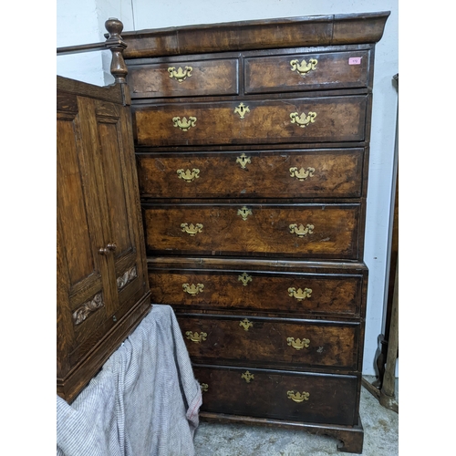 540 - An 18th century and later walnut chest on chest, two short drawers over three graduated drawers, the... 