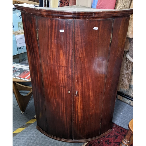 494 - A Georgian mahogany bow fronted corner cabinet 101.5cm h x 71cm w Location: RAM
If there is no condi... 