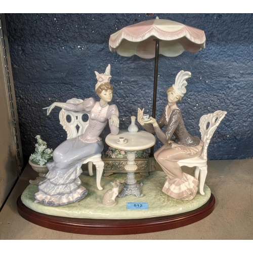 512 - A large Lladro 'Cafe de Paris' figure group depicting two ladies having a cup of tea under a parasol... 