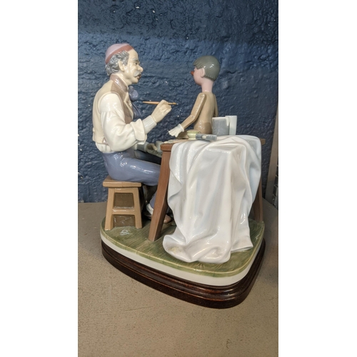 513 - A Lladro porcelain figure group of The Puppet Painter (Pinocchio) designed by Salvatore Furiosse, No... 