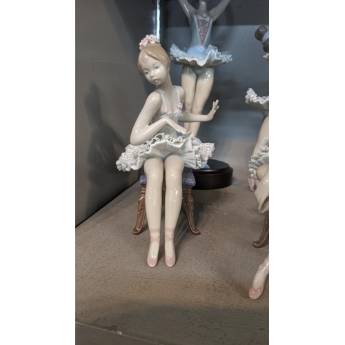 517 - Four Lladro figures of ballerinas to include No 5496, No 5498, No 5497 and other on an oval plinth
L... 