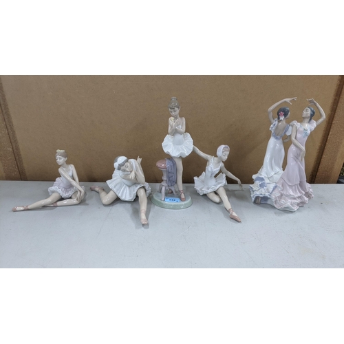 544 - Five Lladro figures of dancers to include three in various seated positions and another in a standin... 