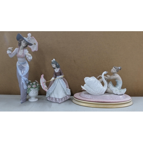 545 - Three Lladro figures to include Jolie opening her parasol No 5210, Flowers of Paris No 6279 and Grac... 