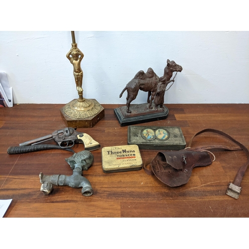 546 - Collectables to include a brass garden tap in the form of a hedgehog, a brass lamp base, a spelter c... 