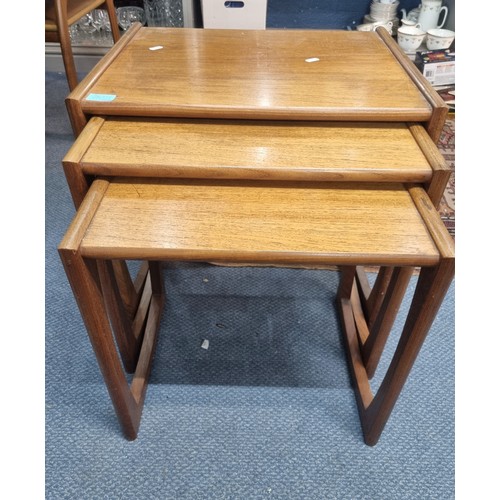 505 - Two mid 20th century teak standard lamps together with a two tier side table, a G-plan nest of three... 