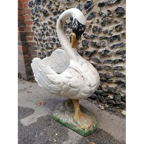 123 - A large early 20th century painted pine garden planter modelled as a swan, with carved detail to the... 