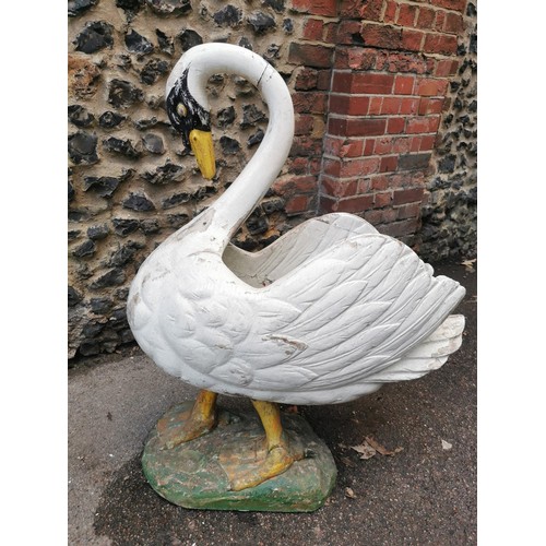 123 - A large early 20th century painted pine garden planter modelled as a swan, with carved detail to the... 