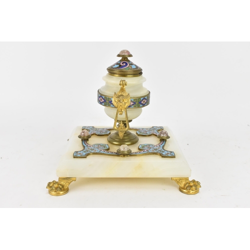 103 - A 19th century French champleve inkwell, in the form of an urn having gilt metal twin handles and li... 