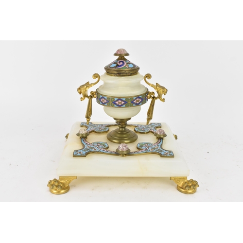 103 - A 19th century French champleve inkwell, in the form of an urn having gilt metal twin handles and li... 