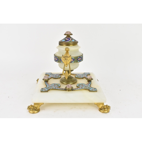 103 - A 19th century French champleve inkwell, in the form of an urn having gilt metal twin handles and li... 