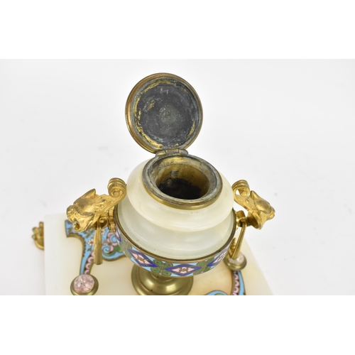 103 - A 19th century French champleve inkwell, in the form of an urn having gilt metal twin handles and li... 