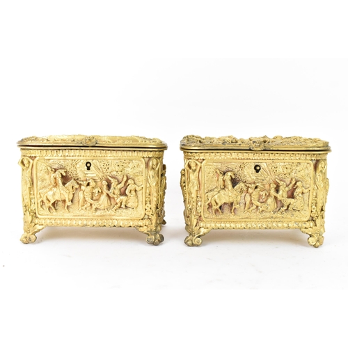 106 - Two 19th century French gilt metal jewellery caskets, each decorated in relief with five panels depi... 