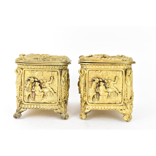 106 - Two 19th century French gilt metal jewellery caskets, each decorated in relief with five panels depi... 