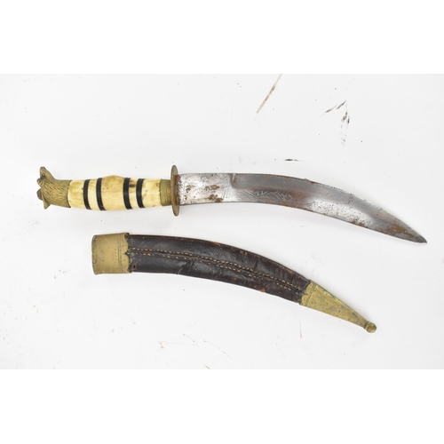 116 - Mixed weapons to include an African dagger having a sheath decorated with cowrie shells, total lengt... 