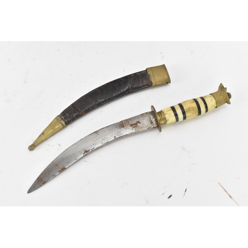 116 - Mixed weapons to include an African dagger having a sheath decorated with cowrie shells, total lengt... 