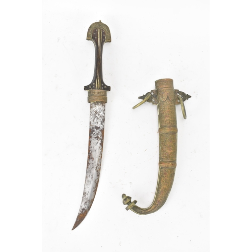 117 - A 19th century Moroccan dagger Jambiya (or Koummya) having a curved blade with a brass engraved scab... 