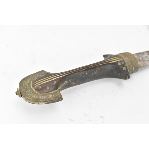 117 - A 19th century Moroccan dagger Jambiya (or Koummya) having a curved blade with a brass engraved scab... 