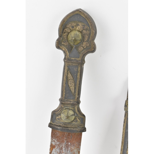 118 - A 19th century Russian Kindjal dagger, the white metal engraved scabbard decorated with a floral scr... 