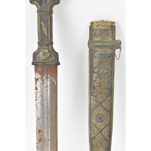 118 - A 19th century Russian Kindjal dagger, the white metal engraved scabbard decorated with a floral scr... 