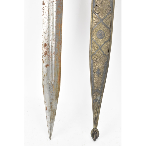 118 - A 19th century Russian Kindjal dagger, the white metal engraved scabbard decorated with a floral scr... 