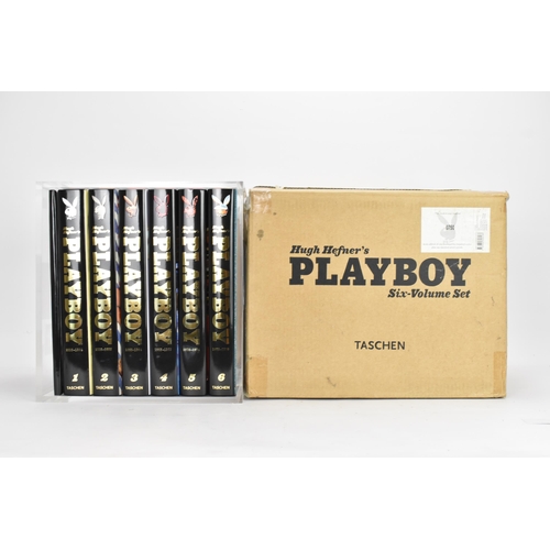 119 - Six volumes of Taschen, Hugh Hefner's Playboy and a reprint of the 1st issue of Playboy, displayed i... 