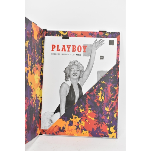 119 - Six volumes of Taschen, Hugh Hefner's Playboy and a reprint of the 1st issue of Playboy, displayed i... 