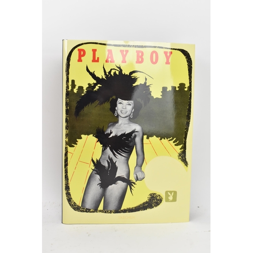 119 - Six volumes of Taschen, Hugh Hefner's Playboy and a reprint of the 1st issue of Playboy, displayed i... 