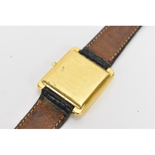 12 - A Raymond Weil, quarts, gents, gold plated wristwatch, having a rectangular dial, the case back numb... 