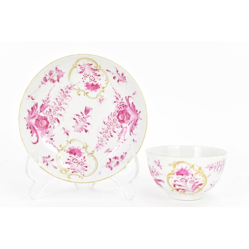 130 - An 18th century Worcester tea bowl and saucer, circa 1765, in the Meissen style with puce floral dec... 