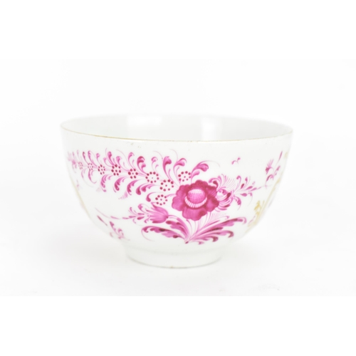 130 - An 18th century Worcester tea bowl and saucer, circa 1765, in the Meissen style with puce floral dec... 