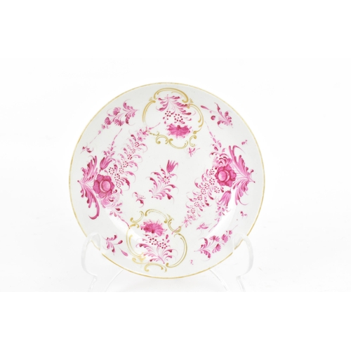 130 - An 18th century Worcester tea bowl and saucer, circa 1765, in the Meissen style with puce floral dec... 