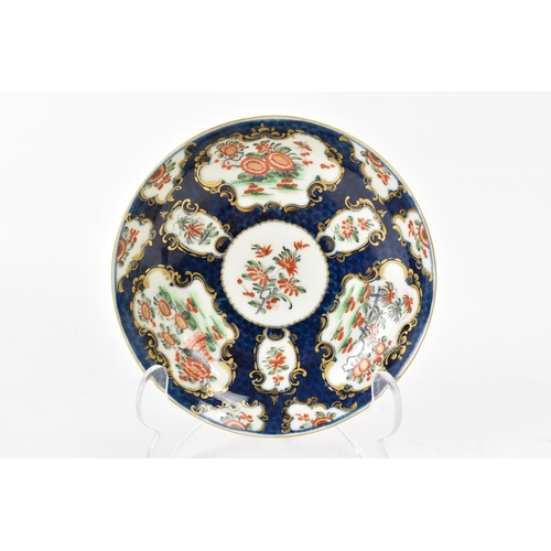 131 - An 18th century Worcester porcelain cup and saucer, circa 1770, painted with chrysanthemums in the R... 