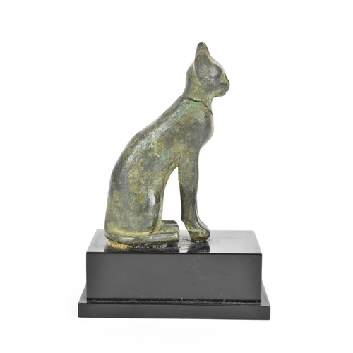 133 - A late Ptolemaic (100-300BC) bronze model of a cat bronze (Bastet), in a seated pose and mounted on ... 