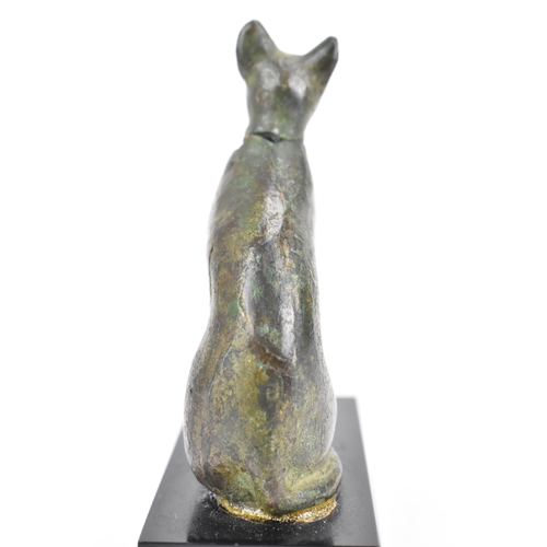 133 - A late Ptolemaic (100-300BC) bronze model of a cat bronze (Bastet), in a seated pose and mounted on ... 