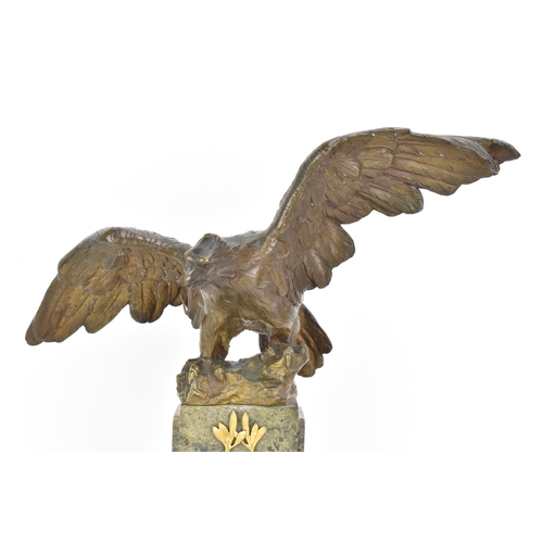 135 - A 19th century French bronze model of an eagle, modelled with outstretched wings with a snake in its... 