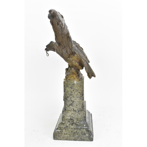 135 - A 19th century French bronze model of an eagle, modelled with outstretched wings with a snake in its... 