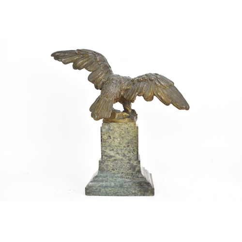 135 - A 19th century French bronze model of an eagle, modelled with outstretched wings with a snake in its... 