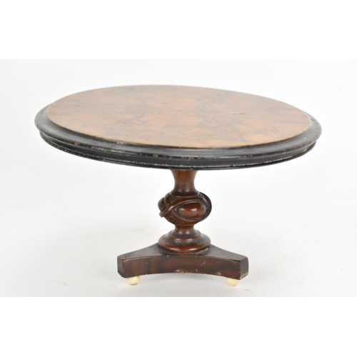 137 - A 19th century walnut table top candle stand, in the form of a breakfast table having a quarter cut ... 