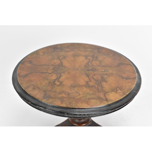 137 - A 19th century walnut table top candle stand, in the form of a breakfast table having a quarter cut ... 