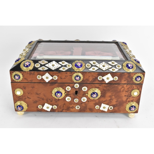 138 - A 19th century French burr yew jewellery casket, having a magnified bevelled glass top, applied with... 