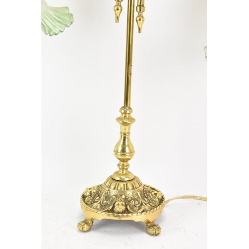 152 - An early 20th century brass adjustable table lamp, having two branches with opalescent green shades,... 