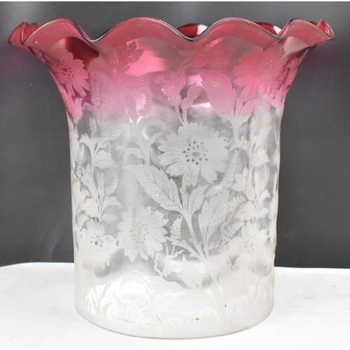 159 - A Victorian cranberry and clear glass shade, having a wavy formed rim and surrounded by acid etched ... 