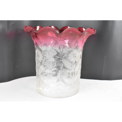 159 - A Victorian cranberry and clear glass shade, having a wavy formed rim and surrounded by acid etched ... 