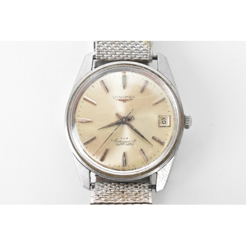 17 - A Longines Conquest, automatic, gents, stainless steel wristwatch, circa 1960s, having a silvered di... 