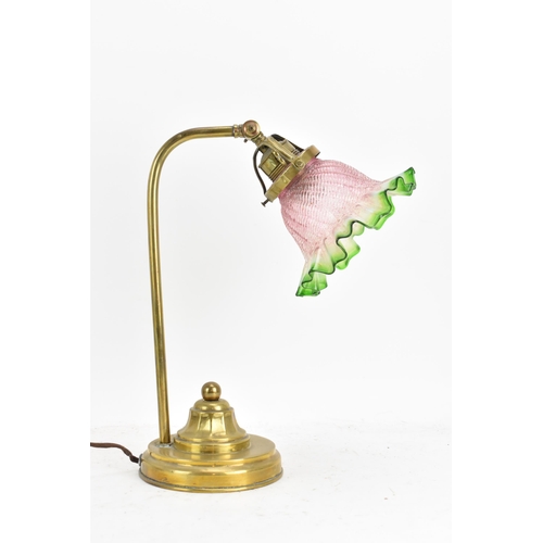 175 - An early 20th century brass table lamp, having a single arm, an adjustable head and an Art Deco gree... 