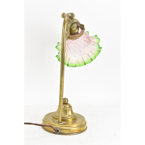 175 - An early 20th century brass table lamp, having a single arm, an adjustable head and an Art Deco gree... 