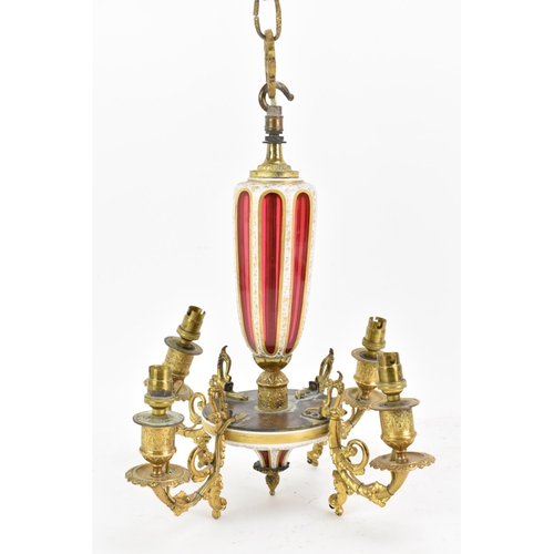 176 - A late 19th century French chandelier, having a bohemian overlaid ruby glass column and finial, with... 